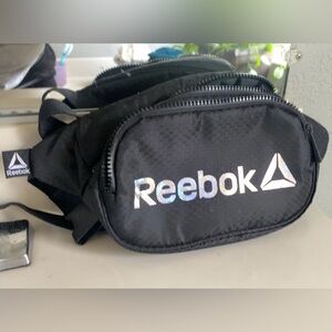 black fanny pack with iridescent logo